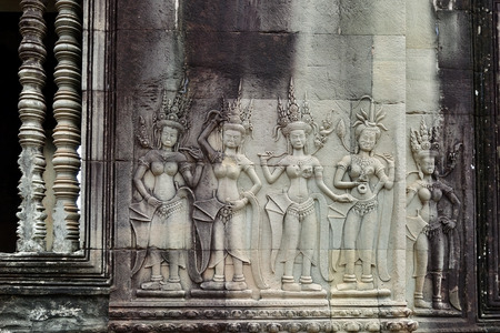 Dancing Apsaras. Hindu sculpture bas relief on the wall in Angkor Wat temple. Cambodiaのeditorial素材