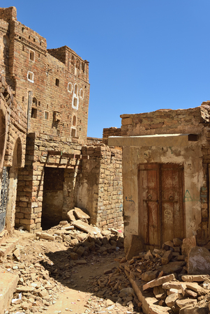 Destroyed houses in the medieval  village of Thula. Yemen. Thula is a UNESCO World Heritage City now destroyed by the civil warの写真素材