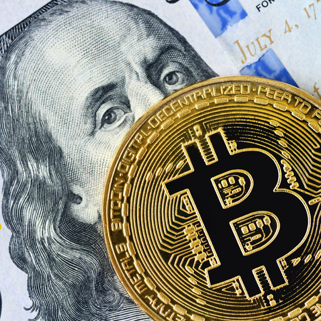 Bitcoin. Crypto currency Bitcoin, BTC, Bit Coin. Bitcoin golden coin on dollar banknote. Blockchain...