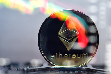 Ethereum. Crypto currency. Ethereum golden coin and a chart. Blockchain technologyの写真素材