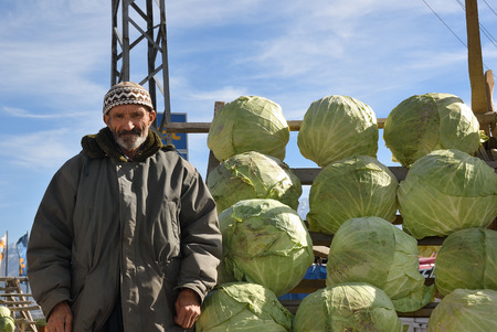 Anatolia, Turkey - November 6, 2009: A indigenous senior peasant sell cabbages along the roadのeditorial素材