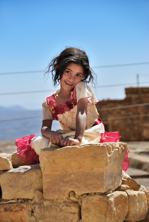 Sanaa, Yemen - March 13, 2010: Unidentified little girl shown in capital of Yemen Sanaa. Children grow up in the poorest country with little opportunity for educationのeditorial素材