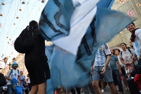 Moscow, Russia - June 23, 2018: Football fans from Argentina and waving national flag on the streets of Moscow. Soccer fans from abroad walking down the Nikolskaya streets in Moscow, FIFA world cup, Mundial 2018のeditorial素材