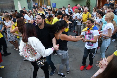 Moscow, Russia - June 23, 2018: Football fans from different countries dancing on the Nikolskaya...