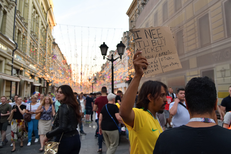 Moscow, Russia - June 26, 2018: Brazilian football fan on the streets of Moscow. Soccer fans from abroad walking down the Nikolskaya street in Moscow, FIFA world cup, Mundial 2018のeditorial素材