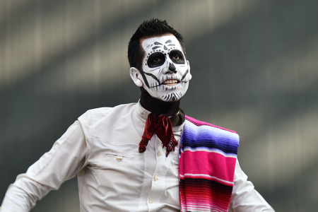 Moscow, Russia - June 29, 2018: Man in sugar skull makeup during Dia de los Muertos Mexican...