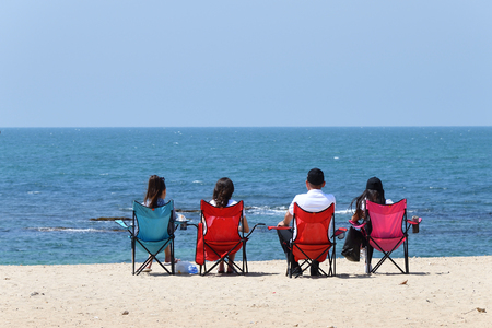 People relaxing on the famous beach of the Roman aqueducts Caesarea Maritima Israelの写真素材
