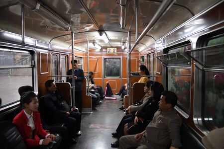 Pyongyang, North-Korea - May 1, 2019: Passengers in the retro subway car. Pyongyang Metroのeditorial素材