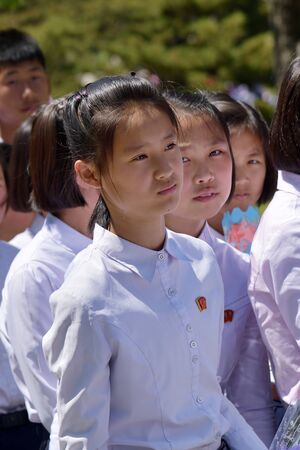 Pyongyang, North Korea - May 1, 2019: Young girls, members of the Kimilsungist-Kimjongilist Youth League on a city streetのeditorial素材