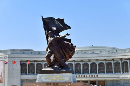 Pyongyang, North Korea - May 2, 2019: Museum of Victory. Statue of a soldier with a flag at the entrance to the Victorious Fatherland Liberation War Museum. North Korea. DPRKのeditorial素材