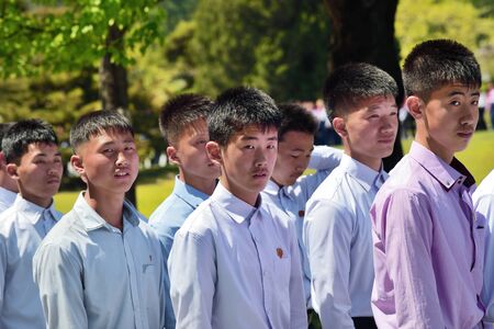 Pyongyang, North Korea - May 1, 2019: Young boys, members of the Kimilsungist-Kimjongilist Youth League visit the Mangyongdae village, birthplace of Kim Il Sungのeditorial素材