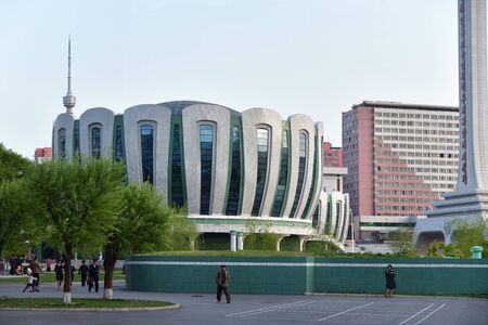 Pyongyang, North Korea - April 29, 2019: People in the new residential complex in the street Ryomyong at twilightのeditorial素材