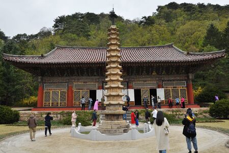 Myohan, North Korea - April 30, 2019: Tourists visit the Buddhist monastery Bohen. It was built in...