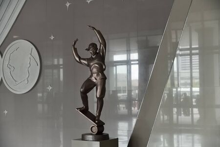 North Korea, Pyongyang - April 30, 2019: Interiors of the Pyongyang State Circus. Sculpture of acrobats in the hall of the buildingのeditorial素材