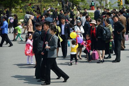Pyongyang, North Korea - May 1, 2019: People gather to celebrate May 1st Labor Day on the Pyongyang streetのeditorial素材
