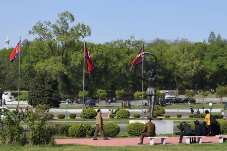 Pyongyang, North Korea - May 1, 2019: Local people resting in the square in front of the Kim Il Sung Stadiumのeditorial素材