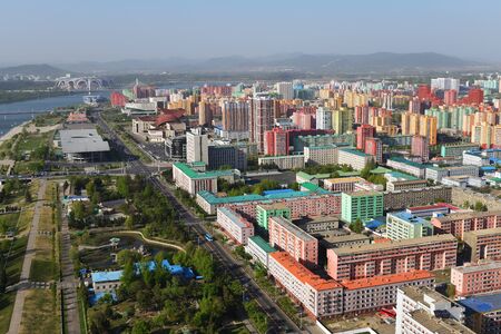 Pyongyang, North Korea - May 1, 2019: View from above on the city, Taedong River and the May Day Stadium from the Juche Tower at sunsetのeditorial素材