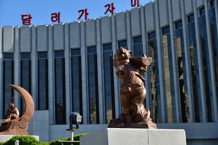 North Korea, Pyongyang - May 2, 2019: Cartoon characters sculptures in front of facade Mangyongdae...