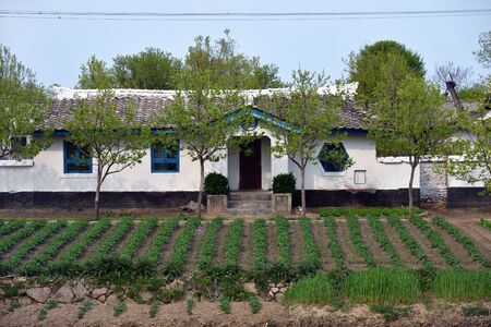 Wonsan region, North Korea - May 3, 2019: Typical house built by the state for residents of countryside.のeditorial素材