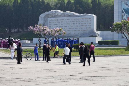 Pyongyang, North Korea - May 1, 2019: People play badminton on May 1st Labor Day on the street in...