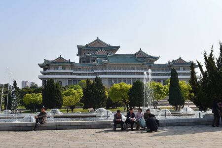 Pyongyang, North Korea - April 29, 2019: People rest near the fountain not far from  Great Peoples Study Houseのeditorial素材