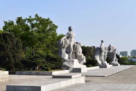 Pyongyang, North Korea - May 1, 2020: Heroic statues in the nearby Juche Tower show at sunset startのeditorial素材