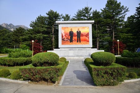 Kumgang, North Korea - May 4, 2019: Memorial to former leaders Kim Il Sung and Kim Jong Il in beautiful park surrounding Kumgangsan Hotel in the Diamond mountains shown at sunriseのeditorial素材