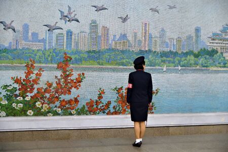 Pyongyang, North Korea - May 1, 2019: Girl in uniform at the Yonggwang subway station. Pyongyang metroのeditorial素材