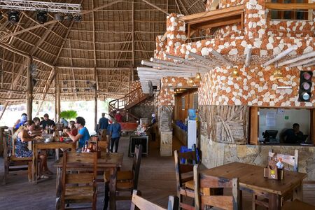 Kendwa, Tanzania - October 3, 2019: Kendwa Rocks Resort customers having breakfast at a hotel restaurant. Zanzibar, Tanzania, Africaのeditorial素材