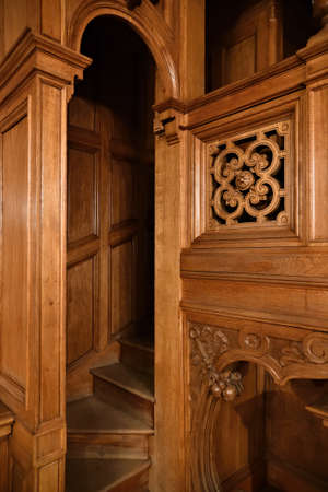 House interiors. Ancient wooden staircase and carved panelsのeditorial素材
