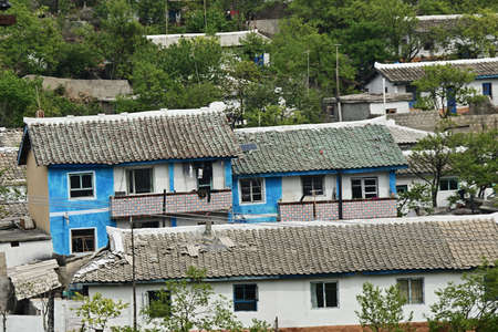 A typical apartment houses in outskirt slum of Wonsan. All housing for householders is provided by the state for freeのeditorial素材