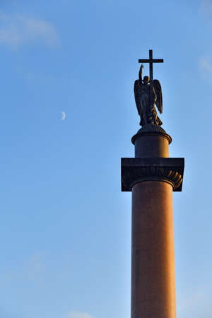 High Alexander Column with an angel against the background of the blue evening sky and growing moon on the sunset -  historical monument of Saint Petersburg, Russiaのeditorial素材