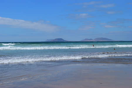 Atlantic ocean and beautiful beach Playa Famara in Canarian island, Lanzarote, Spain