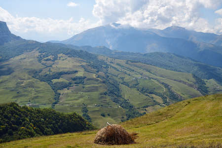 Ð¤ stack of hay. Caucasus alpine meadow and mountains landscape in Chechnya, Russia. Vedeno...