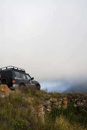 Chechnya, Russia - Sept 12, 2021: Off-road car shown in the Caucasus mountains. Vedeno district of the Chechen Republic. Extreme mountain safari is one of the main local tourist attractions in Chechnyaのeditorial素材