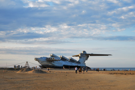 Dagestan, Russia - 25 July, 2022: Tourists walking around the abandoned Soviet Lun-class ekranoplan...