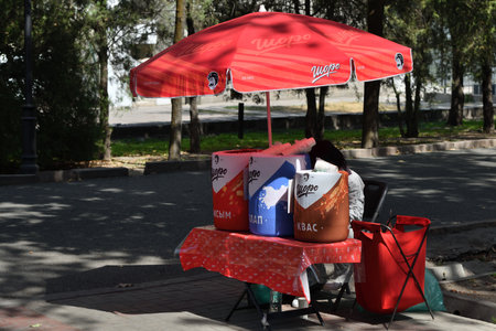 Bishkek, Kyrgyzstan - 21 September, 2022: Sale of traditional drinks in one of the parks in Bishkek. Bishkek formerly Frunze, is the capital and the largest city of the Kyrgyz Republicの写真素材