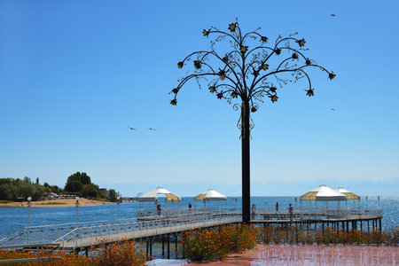 Cholpon-Ata, Kyrgyzstan - September 14, 2022: Embankment of Issyk-Kul lake in Ruh Ordo Cultural complex named after famous Kyrgyz writer Chinghiz Aitmatovのeditorial素材