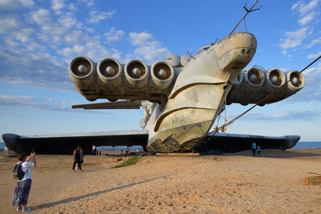 Dagestan, Russia - 25 July, 2022: Tourists walking around the abandoned Soviet Lun-class ekranoplan on the coast of the Caspian Seaのeditorial素材