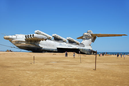 Dagestan, Russia - 25 July, 2022: Tourists walking around the abandoned Soviet Lun-class ekranoplan...