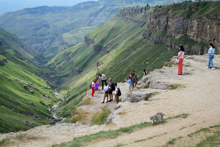 Dagestan, Russia - 21 July, 2022: People on the edge of the Khunzakh Canyon in the Republic of Dagestan, Russia. Stunning landscape of the Caucasus mountainsのeditorial素材