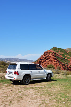 Issyk-Kul, Kyrgyzstan - Sept 19, 2022: Off-road car shown in canyon Seven bulls, Jeti-Oguz, Kyrgyzstan. Extreme mountain safari is one of the main local tourist attractions in Kyrgyzstanのeditorial素材
