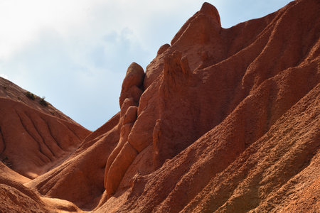 Amazing scenery of the Fairy Tale Canyon also known as Skazka red rock formations of sandstone nearby the Issyk-Kul lake. Kyrgyzstan. Central Asiaの写真素材