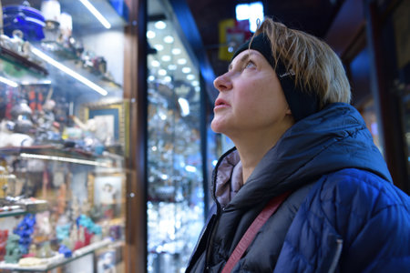 Istanbul, Turkey - December 10, 2023: Woman in the Grand Bazaar the largest covered shopping complex in the cityのeditorial素材