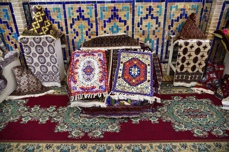 Carpets for sale in Tilya-Kori Madrasah on the Registan square in Samarkand