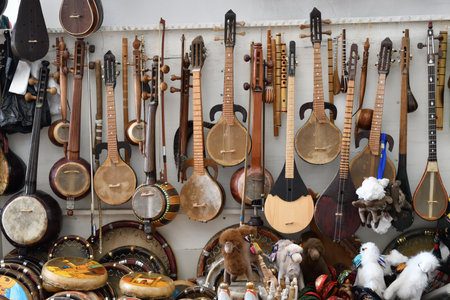 The traditional Uzbek musical instruments such as rubab, sato, dutor and doira for sale. Bukhara. Uzbekistanの写真素材