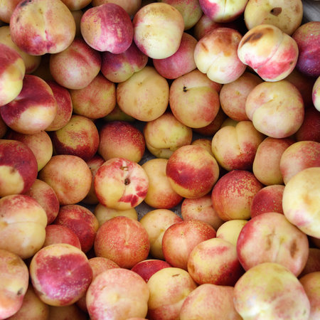 Fresh nectarine for sale on a food market. Bukhara, Uzbekistan. Selective focus