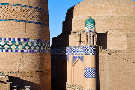 Islam Khodja Minaret detail view at sunset in Ichan Kala, ancient inner town of the old city Khiva in Khorezm region, Uzbekistanの写真素材