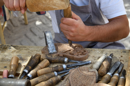 Artisans carve into wood in the historical city of Khiva, Uzbekistan