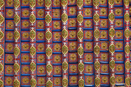 Wooden ceiling oriental ornaments from Khiva, Uzbekistan. Highly detailed background with rich...
